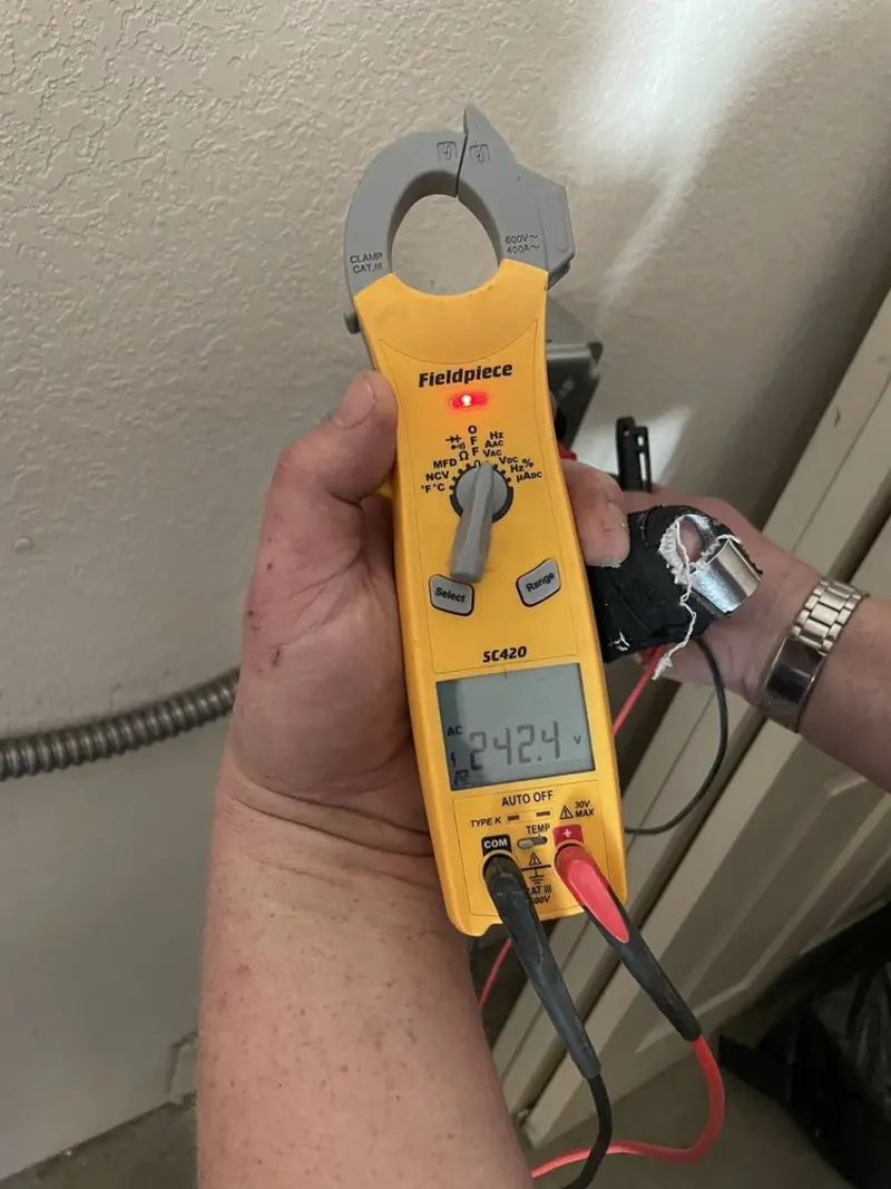 Voltage testing with clamp meter during Outlet Installation in Downingtown